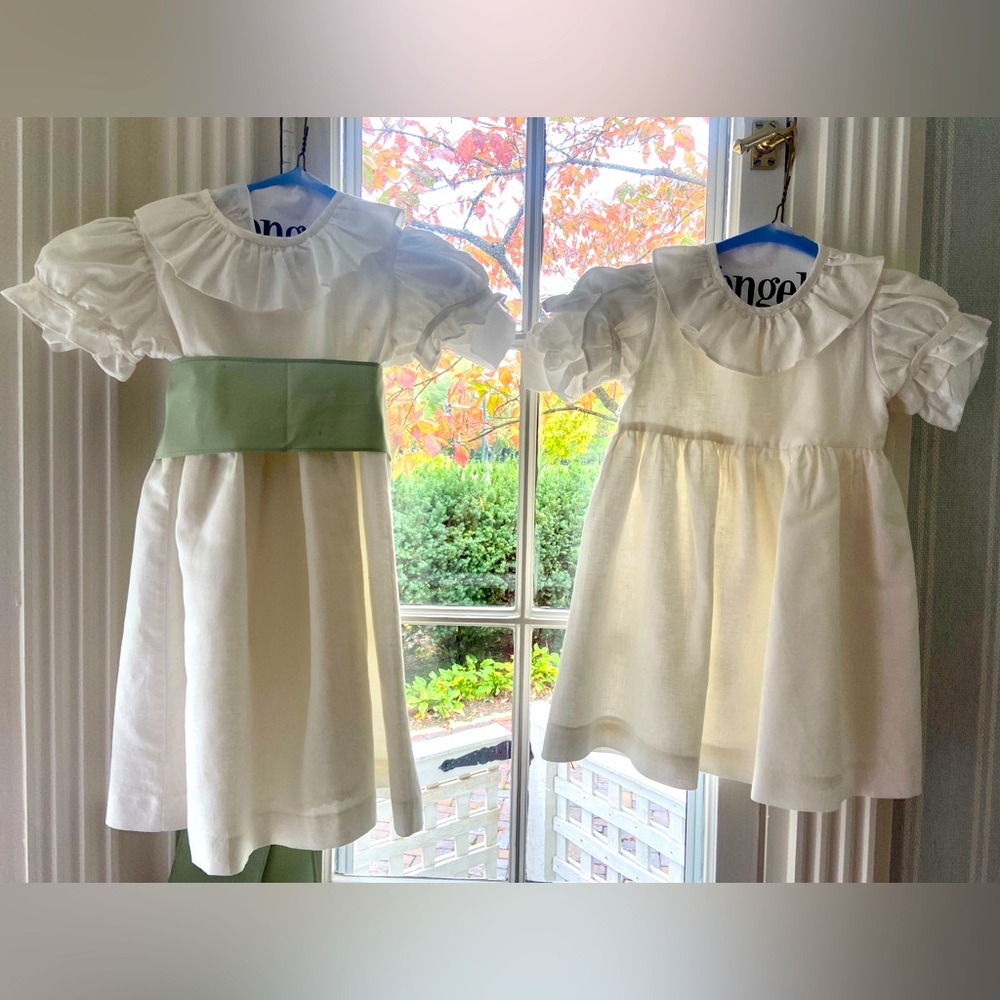 white La Coqueta Flower Girl Dress with Green Sashes